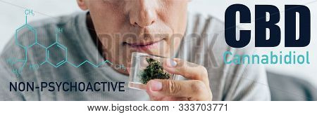 Cropped View Of Man In T-shirt Holding Medical Cannabis In Glass Container, Panoramic Shot With Non-