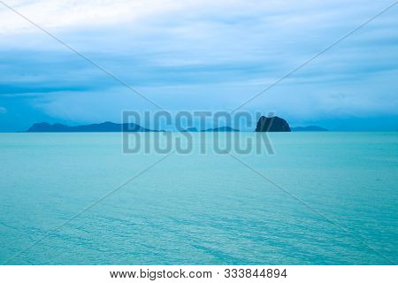 Tropical Shore Of Koh Samui With Hills Near The Water On A Sunny Day