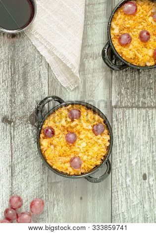 Top View Of Crumbs. Typical Spanish Food With Grapes