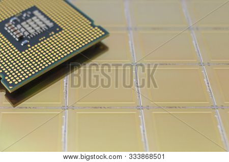 Computer Cpu Processor Chip On Yellow Surface Of Slicion Wafer Chip Background