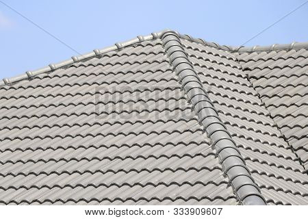 The Roof Tile With The Sky Background. The Grey Roman Tile Pattern.