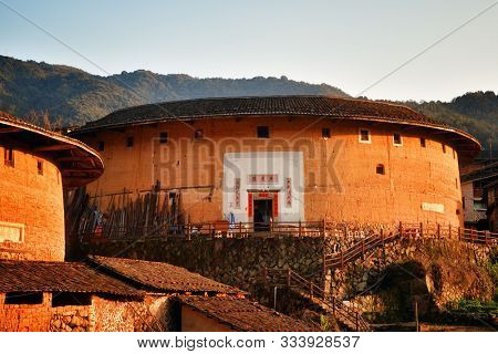 FUJIAN, CHINA â MARCH 2, 2018: Chuxi Tulou Cluster. Tulou is the unique traditional rural dwelling of Hakka.