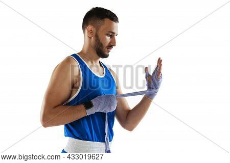 Side View Cropped Portrait Of Professional Boxer Tying Boxing Handwraps Isolated Over White Backgrou