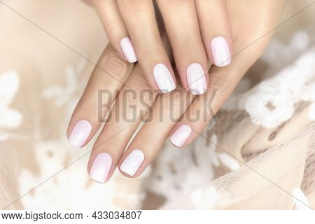 Beautiful Female Hands With Gentle Pink Manicure. Beautiful Manicure With Openwork Nail Art.