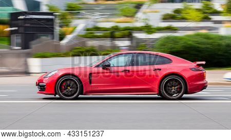 Moscow, Russia - August 2021: Red Car Porsche 971 Panamera At The City Street. Panamera Gts Fast Mov