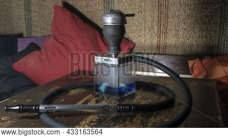 Hookah Square Flask On The Wooden Table. Original Square Designer Hookah.
