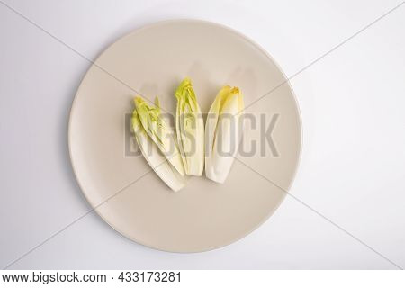 Endive On Plate Top View On White Background, Salad Chicory Roots, Healthy Organic Food Concept, Veg