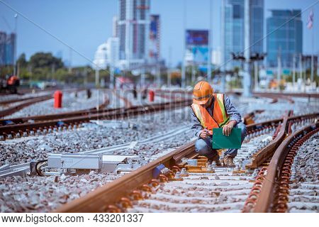 Engineer railway under  checking construction process train testing and checking railway work on rai