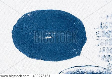 Circle stamped on white fabric