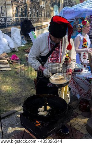 Korosten' Ukraine - September 04 2021: Festival Of Potato Pancakes In The City Park. A Colorful Man 