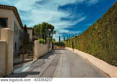 French town street view in town Aix-en-Provence with yellow car. Aix-en-Provence, France
