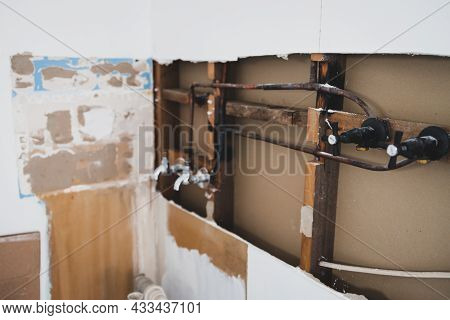 Laundry Room Renovation With Plaser Walls Interior Exposed With Visible Electricity Wires And Copper