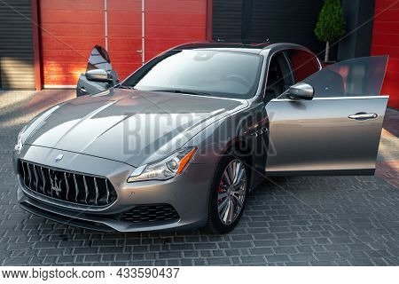 Ukraine, Odessa - September 8, 2021: Maserati Ghibli Sport Car Parked Near The Garage With Open Door