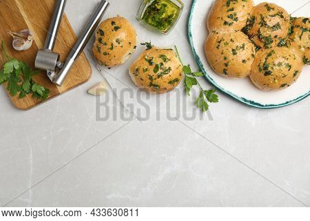 Traditional Ukrainian Bread (pampushky) With Garlic On Light Grey Marble Table, Flat Lay. Space For 