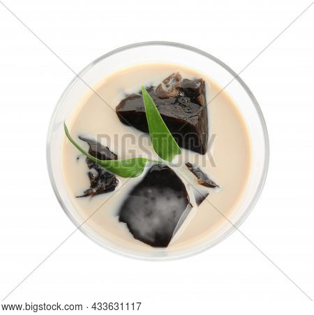 Glass Of Milk With Grass Jelly And Green Leaves Isolated On White, Top View