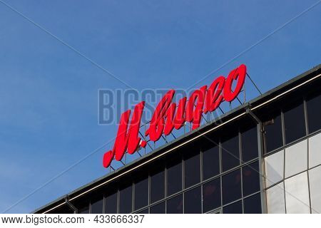 Krasnoyarsk, Russia - September 18, 2021: Logo Of Electronic Hypermarket M.video Against Blue Sky. L