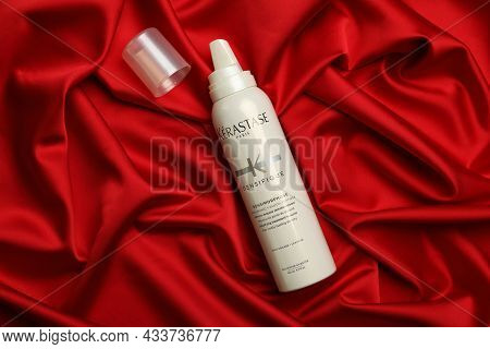 Mykolaiv, Ukraine - September 08, 2021: Bottle Of Kerastase Hair Care Cosmetic Product On Red Fabric