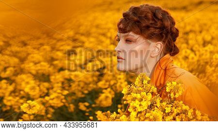 Portrait Of Red Haired Women Dressed In Trendy Fall Orange Trench Coat In Colourful Orange Field. Fa