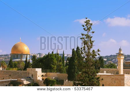 The Holy City of Jerusalem is lit by the morning sun.  Golden Dome Mosque of Caliph Omar