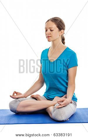 Yoga - young beautiful woman yoga instructor doing Lotus Position (padmasana with chin mudra) asana exercise - cross-legged sitting asana for meditation - isolated on white background