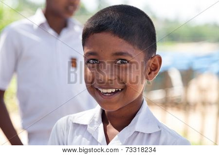 HABARADUWA, SRI LANKA - MARCH 11, 2014: Portrait of school kid at Sea Turtle Farm and Hatchery. The center was started in 1986 and up to now they released more than 500,000 Turtles to ocean