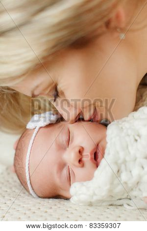 Portrait of a mother with her newborn baby