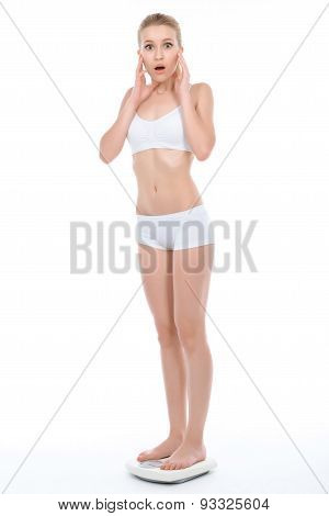 Young fit blond girl isolated on white