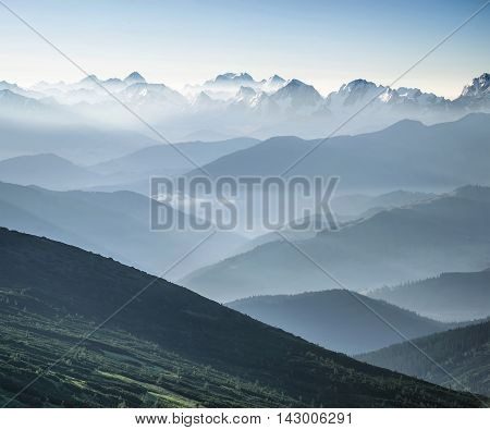 Hills during sunrise in mountain valley. Beautisul natural landscape