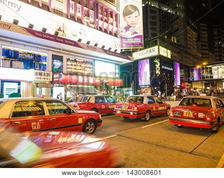 HONG KONG - OCT 22: Tsim Sha Tsui at night on October 2 2015 in Hong Kong. Tsim Sha Tsui is a major tourist hub in metropolitan Hong Kong with many high-end shops and restaurants