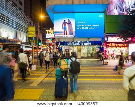 HONG KONG - OCT 22: Tsim Sha Tsui at night on October 2 2015 in Hong Kong. Tsim Sha Tsui is a major tourist hub in metropolitan Hong Kong with many high-end shops and restaurants