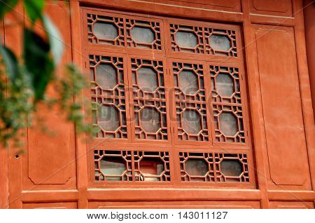 Deyang China - Nobember 5 2009: Intricate wooden window tracery on Qisheng Hall at the Deyang Confucian Temple