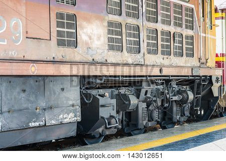 Beside of Locomotive train park on rail