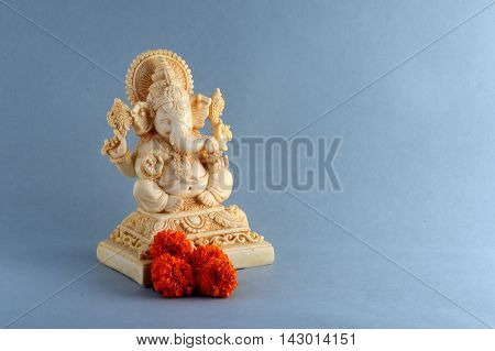 Hindu God Ganesha. Ganesha Idol on grey background