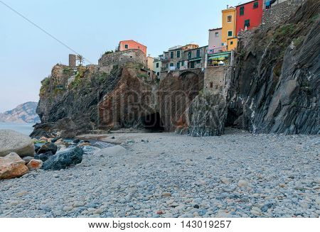 Municipal pebble beach in the old village of Vernazza. Parco Nazionale delle Cinque Terre, Liguria, Italy.