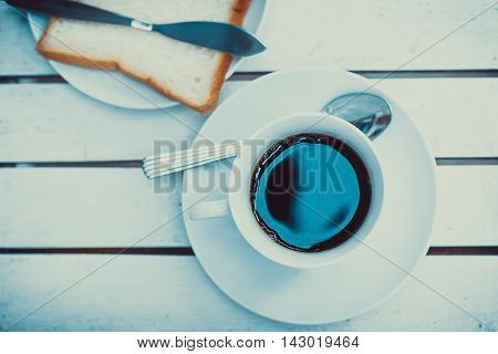 Coffee cup top view on wooden table background