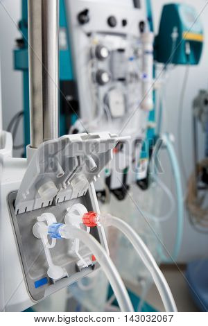 Hemodialysis bloodline tubes connected to hemodialysis machine. Health care blood purification kidney failure transplantation medical equipment concept.