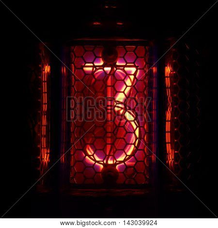 The real Nixie tube indicator of the numbers of retro style. Indicator glow with a magical purple fringing. Digit 3