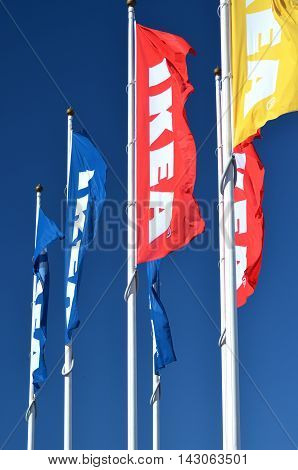 CIRCA AUGUST 2016 - GDANSK: logo of ikea on waving flags against blue sky. IKEA is multinational group of companies designing and selling ready-to-assamble furniture. It was founded in 1943 in Almhult, Sweden.