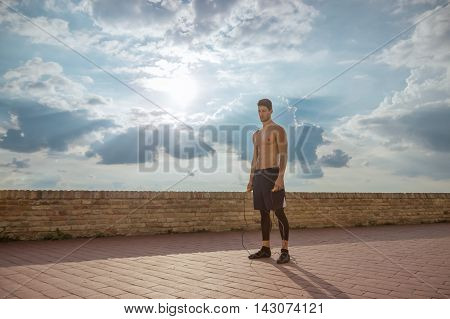 shirtless fit fitness man model posing sky