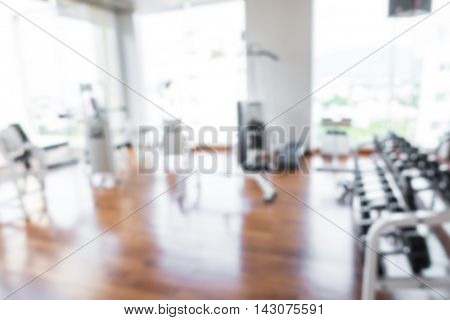Abstract blur Fitness center with traineger equipments