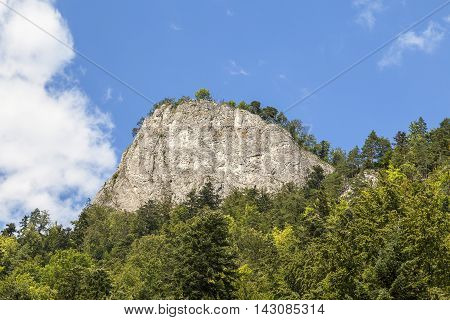 View on top Sokolica in Pieniny Mountains from boat rafting in sunny day Poland