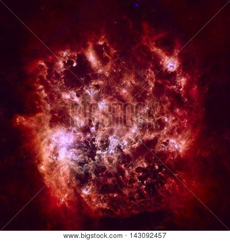 Infrared Portrait of the Large Magellanic Cloud. Cosmic dust clouds ripple across our Milky Way's satellite galaxy the Large Magellanic Cloud. Elements of this image furnished by NASA.
