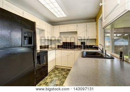 Classic American Kitchen Romm Interior With White Wooden Cabinets.