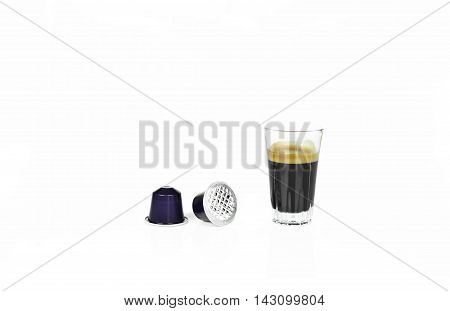 Single-serve espresso shot coffee capsules on white background