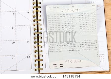 Saving account from bank on wood tablel