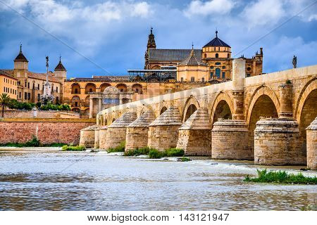 Cordoba Spain Andalusia. Roman Bridge on Guadalquivir river and The Great Mosque (Mezquita Cathedral).