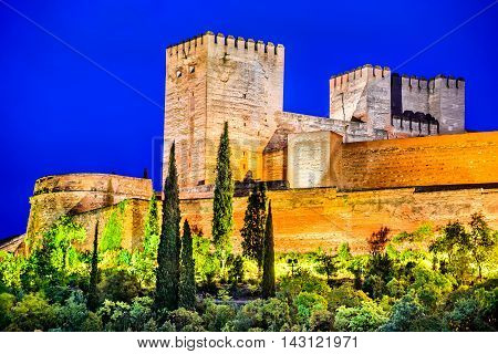 Granada Spain. Night View of famous Alhambra with Alcazaba European travel landmark in Andalusia.