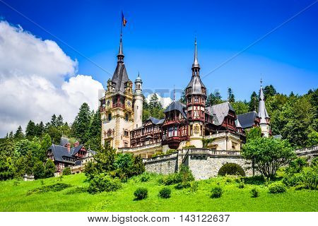 Peles Castle Romania. Beautiful famous royal residence with ornamental garden in Sinaia Carpathian Mountains Europe.