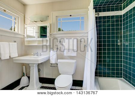 Bathroom With Wooden Panel Walls And Shower Bath Tub