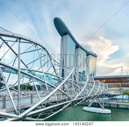 Singapore, Republic of Singapore - May 3, 2016: Helix spiral double bridge leading to Marina Bay Sands hotel